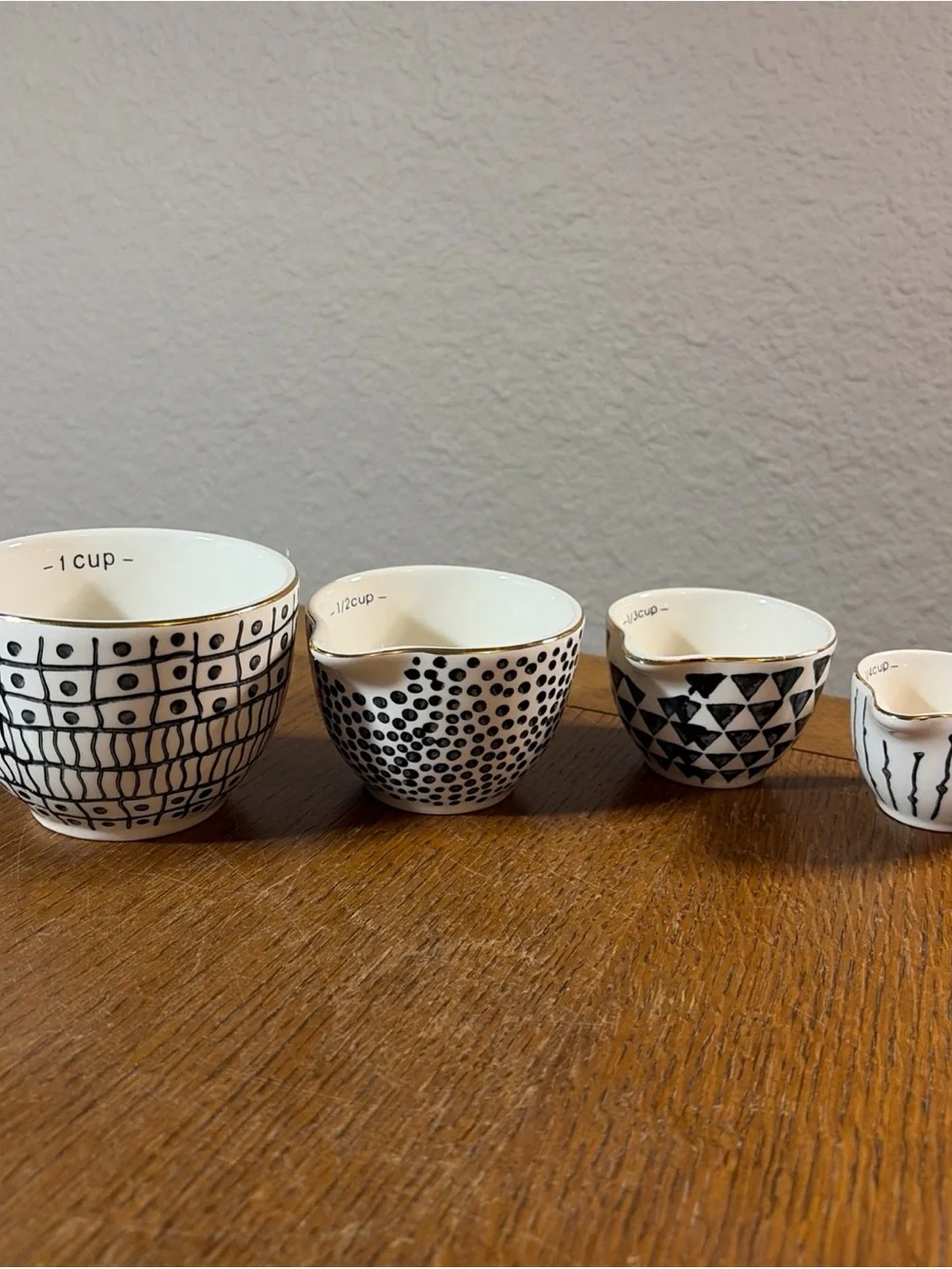 Ceramic Nested Measuring Cups with Black Geometric Pattern and Gold Rim